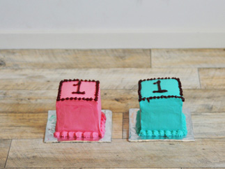 Two cute first birthday cakes