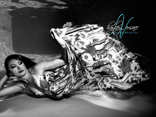 Dressed girl diving in the pool