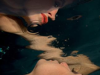 Pretty girl's reflection underwater